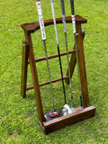 walnut outdoor golf putter stand with scotty Cameron putter 