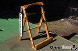 outdoor golf putter stand with personalized golf sign on perfect practice golf platform