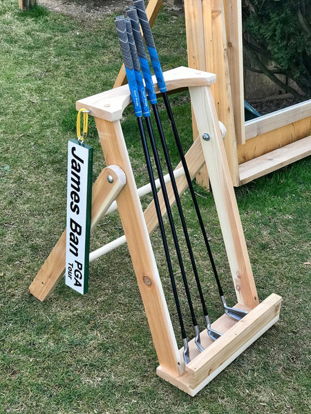 scotty cameron putter on outdoor putter stand with personalized golf sign